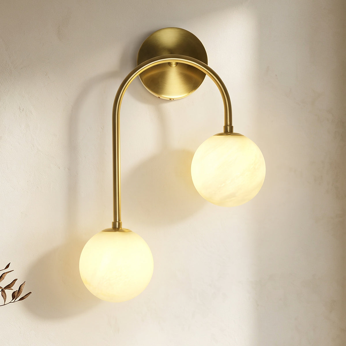 Modern 2-Light Globe Wall Sconce with Faux Alabaster Glass Shades and Brass Finish